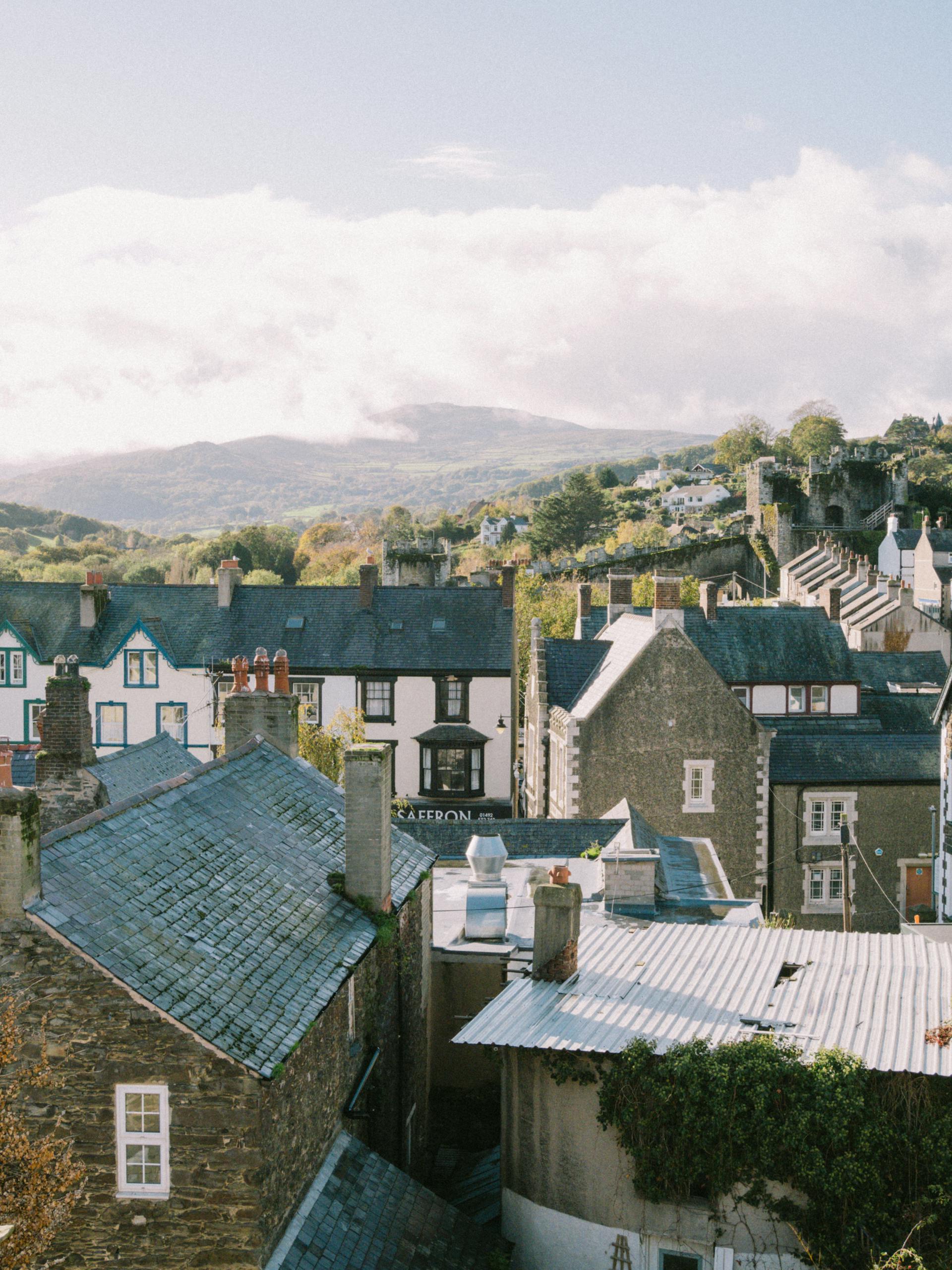 Charming rooftop view of Conwy town with scenic landscape and mountains in Wales.